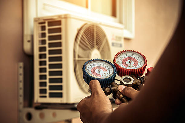 Professional Ductwork Repair technician working in Fayetteville, AR